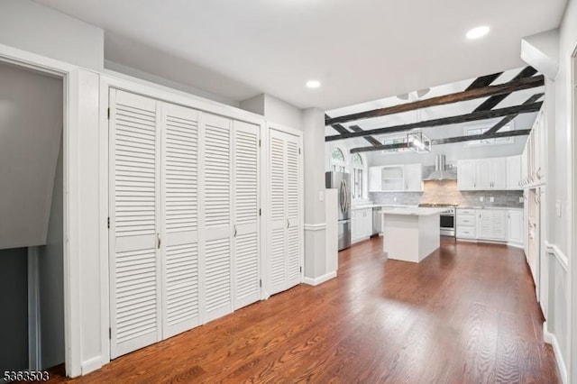 2 Linden Ave, West Orange Twp, NJ 07052 - unfurnished bedroom with freestanding refrigerator, dark wood-type flooring, two closets, beam ceiling, and recessed lighting