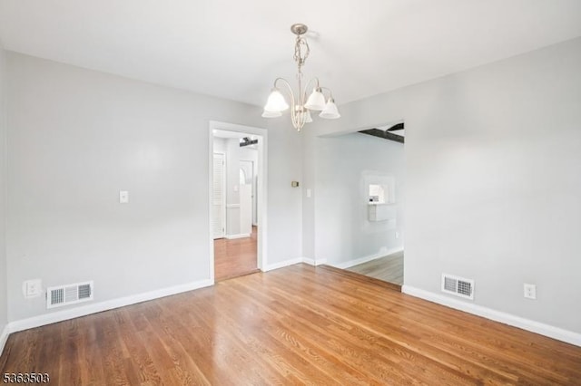 2 Linden Ave, West Orange Twp, NJ 07052 - spare room featuring a chandelier and wood finished floors