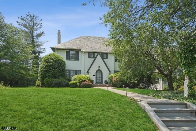 508 Park St, Montclair Twp, NJ 07043 - english style home with stucco siding, a chimney, and a front lawn