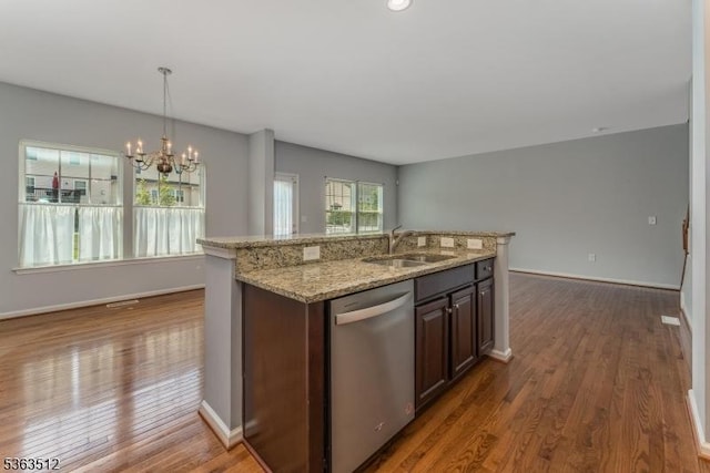 84 Washington Square Cir, Washington Boro, NJ 07882 - kitchen with stainless steel dishwasher, wood finished floors, a chandelier, light stone countertops, and open floor plan