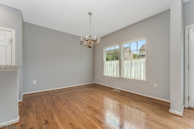84 Washington Square Cir, Washington Boro, NJ 07882 - spare room featuring a chandelier and hardwood / wood-style floors