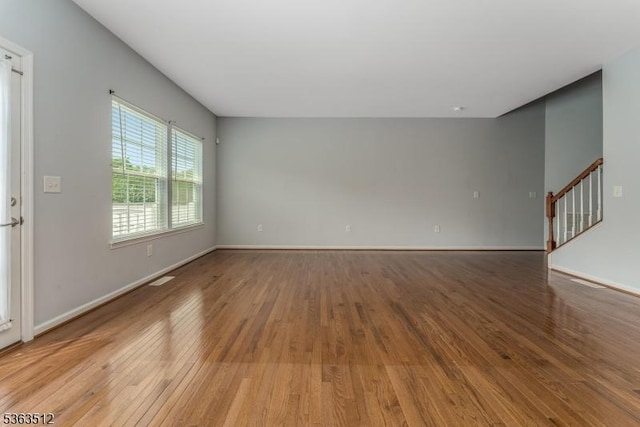 84 Washington Square Cir, Washington Boro, NJ 07882 - unfurnished living room with light wood finished floors and stairway