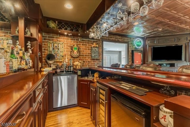 5 Brendan Dr, Mount Olive Twp, NJ 07836 - bar featuring refrigerator, brick wall, light wood finished floors, and an ornate ceiling