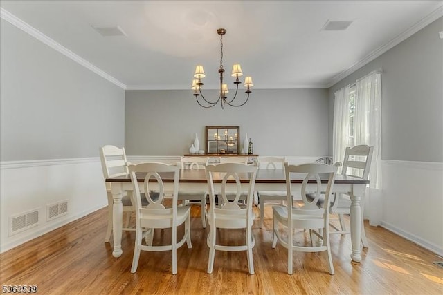 5 Brendan Dr, Mount Olive Twp, NJ 07836 - dining space with a chandelier, wood finished floors, and crown molding