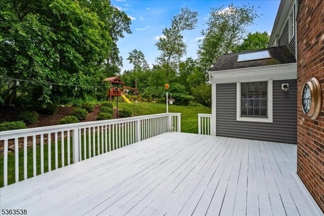 5 Brendan Dr, Mount Olive Twp, NJ 07836 - wooden deck featuring a playground and a lawn