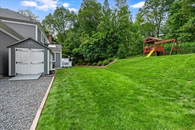 5 Brendan Dr, Mount Olive Twp, NJ 07836 - view of grassy yard featuring a playground, a storage shed, and view of wooded area