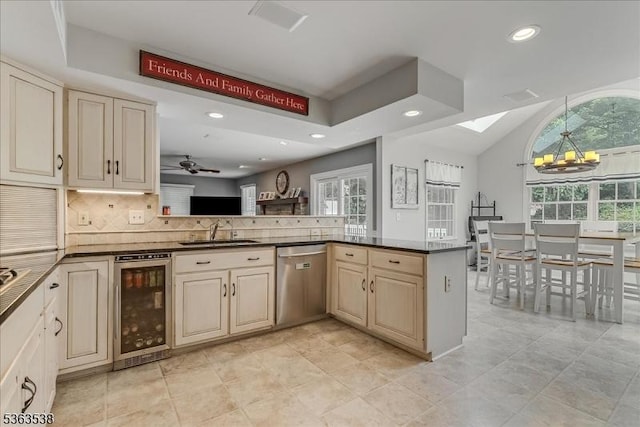 5 Brendan Dr, Mount Olive Twp, NJ 07836 - kitchen featuring wine cooler, stainless steel dishwasher, cream cabinets, a chandelier, and dark countertops