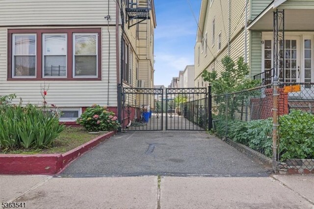 255 Ampere Pkwy, Bloomfield Twp, NJ 07003 - view of home's exterior with a gate and driveway