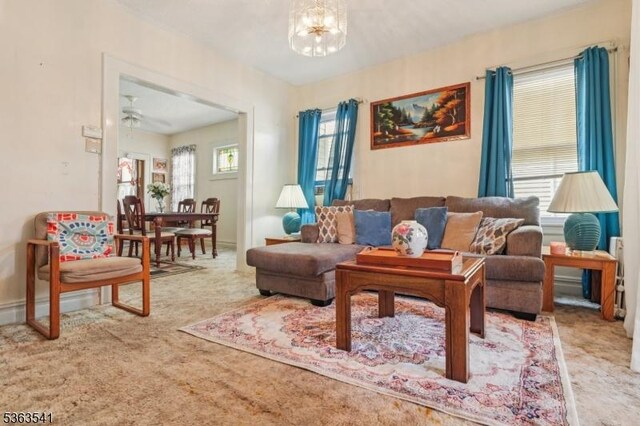 255 Ampere Pkwy, Bloomfield Twp, NJ 07003 - living area with carpet floors, a chandelier, and a ceiling fan
