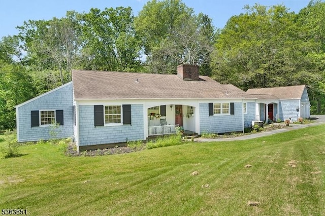 12 Schoolhouse Ln, Morris Twp, NJ 07960 - view of front of house featuring a porch, a front yard, a chimney, and roof with shingles