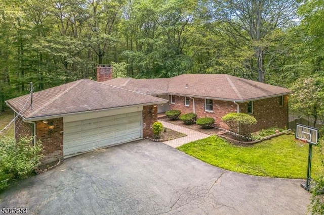 3 Christine Ct, Kinnelon Boro, NJ 07405 - single story home with a chimney, driveway, an attached garage, brick siding, and a wooded view