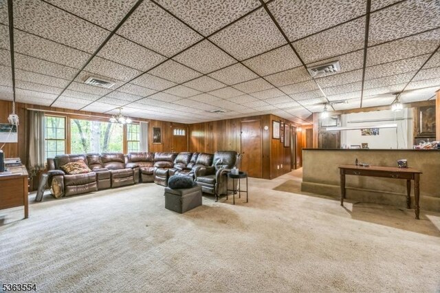 3 Christine Ct, Kinnelon Boro, NJ 07405 - carpeted living room with wooden walls and a drop ceiling
