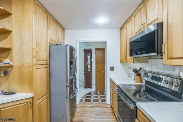 3 Christine Ct, Kinnelon Boro, NJ 07405 - kitchen with appliances with stainless steel finishes, open shelves, light countertops, tasteful backsplash, and light wood-type flooring