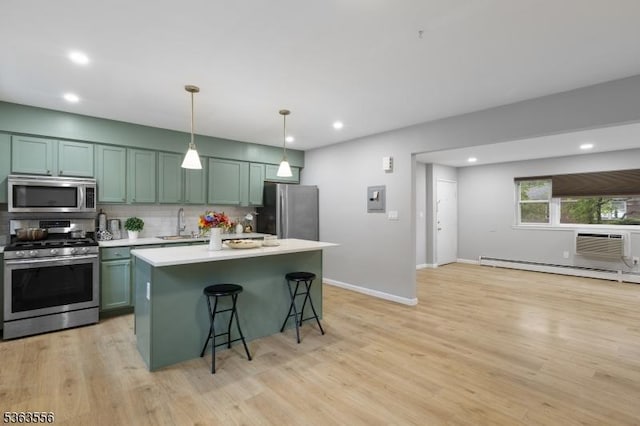 2467 State Route 10, Parsippany-Troy Hills Twp, NJ 07950 - kitchen with stainless steel appliances, decorative backsplash, light countertops, recessed lighting, and a kitchen bar