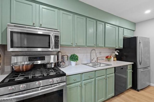2467 State Route 10, Parsippany-Troy Hills Twp, NJ 07950 - kitchen featuring stainless steel appliances, green cabinetry, tasteful backsplash, and recessed lighting