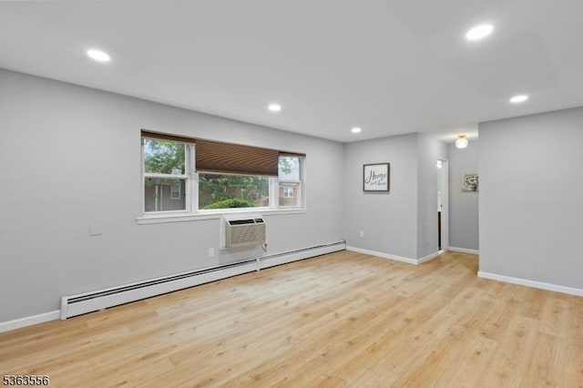 2467 State Route 10, Parsippany-Troy Hills Twp, NJ 07950 - empty room with a baseboard radiator, recessed lighting, wood finished floors, and a wall mounted AC