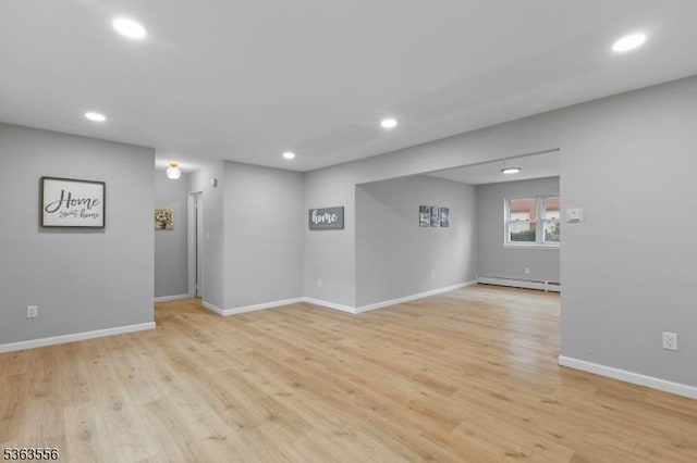 2467 State Route 10, Parsippany-Troy Hills Twp, NJ 07950 - empty room with baseboard heating, recessed lighting, and light wood-style flooring