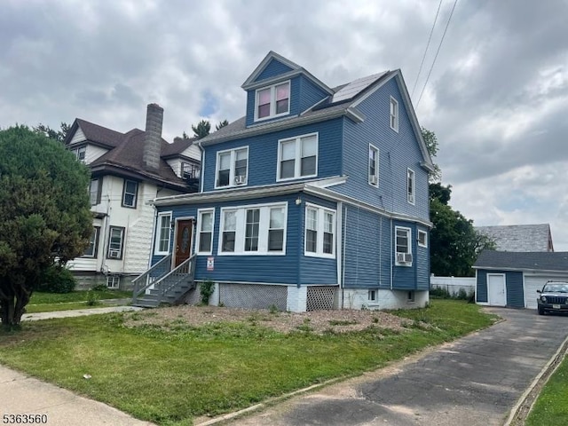 900 Sanford Ave, Irvington Twp, NJ 07111 - view of front of home with an outdoor structure, a front yard, and entry steps