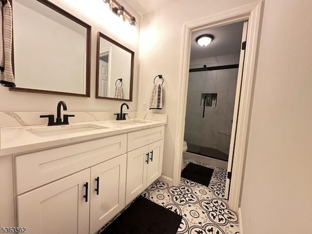 43 Kensington Ct, Washington Twp, NJ 07840 - bathroom featuring toilet, double vanity, a stall shower, tile patterned floors, and baseboards