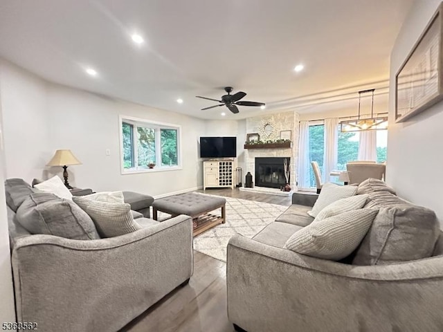 43 Kensington Ct, Washington Twp, NJ 07840 - living area with dark wood finished floors, recessed lighting, plenty of natural light, a ceiling fan, and a fireplace