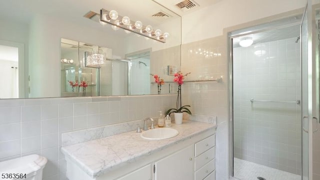 80 Clark Rd, Bernardsville Boro, NJ 07924 - bathroom with tile walls, vanity, a shower stall, and decorative backsplash