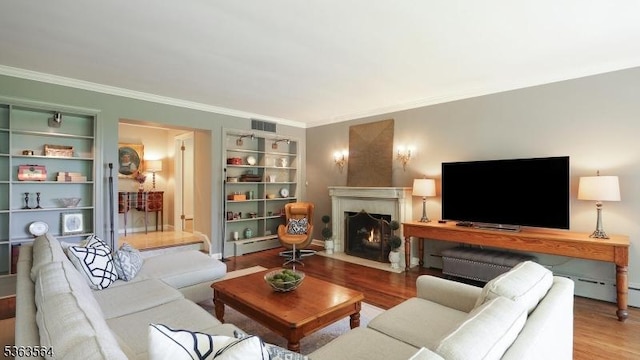 80 Clark Rd, Bernardsville Boro, NJ 07924 - living area with wood finished floors, a fireplace with flush hearth, and crown molding