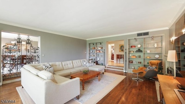 80 Clark Rd, Bernardsville Boro, NJ 07924 - living room with wood finished floors, ornamental molding, and built in shelves