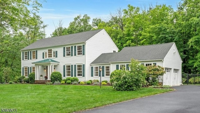 11 Carteret Trl, Bernards Twp, NJ 07920 - colonial inspired home with asphalt driveway, a front yard, and a garage