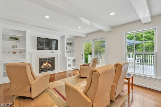 11 Carteret Trl, Bernards Twp, NJ 07920 - living room with beam ceiling, light wood-style floors, a fireplace with flush hearth, recessed lighting, and built in features