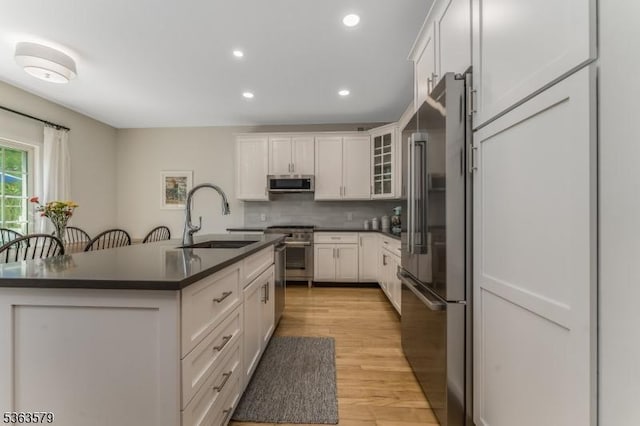 22 La Costa Dr, Clinton Twp, NJ 08801 - kitchen with stainless steel appliances, dark countertops, decorative backsplash, white cabinetry, and recessed lighting