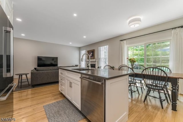 22 La Costa Dr, Clinton Twp, NJ 08801 - kitchen featuring stainless steel appliances, dark countertops, white cabinets, light wood-style floors, and open floor plan