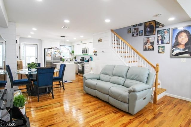 281 Oregon St, Union Twp, NJ 07088 - living area featuring light wood-type flooring, stairs, and recessed lighting