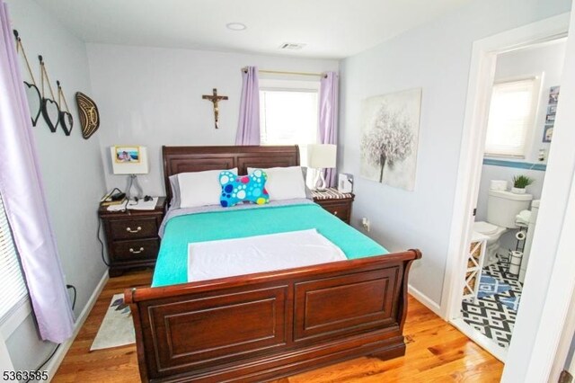 281 Oregon St, Union Twp, NJ 07088 - bedroom featuring light wood-style flooring and ensuite bath