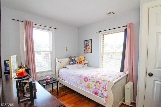 281 Oregon St, Union Twp, NJ 07088 - bedroom featuring radiator, multiple windows, and wood finished floors