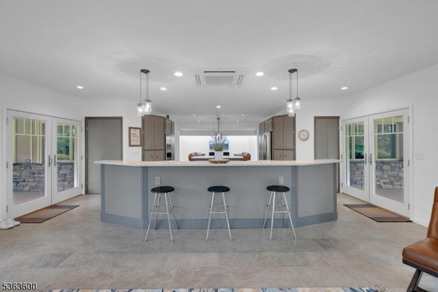 525 Watters Rd, Mansfield Twp, NJ 07840 - kitchen with french doors, freestanding refrigerator, recessed lighting, a kitchen breakfast bar, and healthy amount of natural light