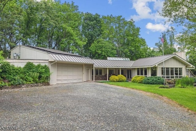 525 Watters Rd, Mansfield Twp, NJ 07840 - single story home with an attached garage, driveway, a metal roof, a standing seam roof, and a front yard