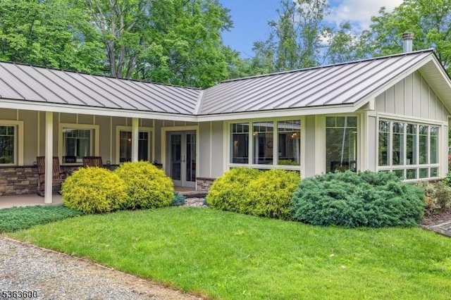 525 Watters Rd, Mansfield Twp, NJ 07840 - rear view of property with a standing seam roof, a metal roof, a lawn, stone siding, and french doors
