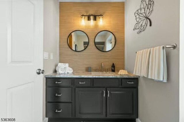 32 Ryan Ln, Lincoln Park Boro, NJ 07035 - bathroom with vanity and decorative backsplash