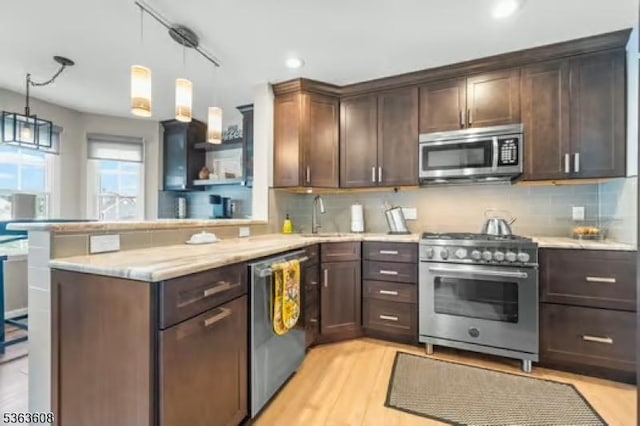32 Ryan Ln, Lincoln Park Boro, NJ 07035 - kitchen with appliances with stainless steel finishes, a peninsula, dark brown cabinets, tasteful backsplash, and recessed lighting