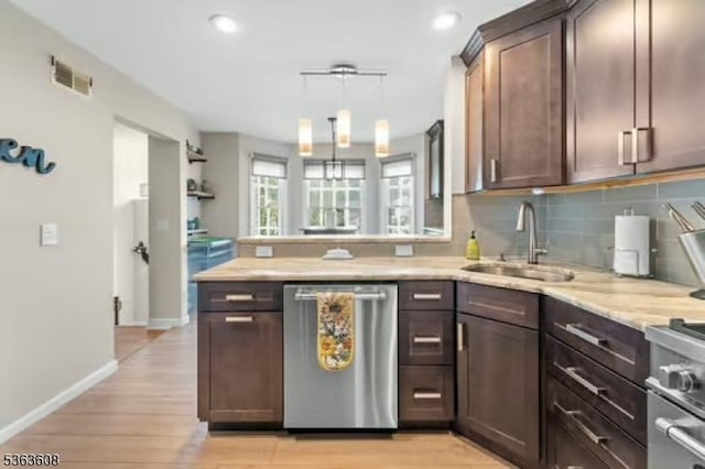 32 Ryan Ln, Lincoln Park Boro, NJ 07035 - kitchen featuring appliances with stainless steel finishes, a peninsula, tasteful backsplash, light wood finished floors, and recessed lighting
