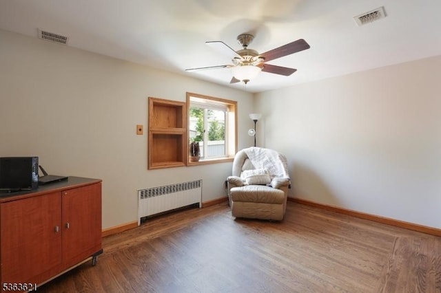 44 Shetland Dr, Clark Twp, NJ 07066 - sitting room with radiator, a ceiling fan, and wood finished floors