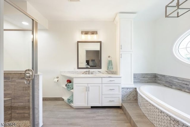 44 Shetland Dr, Clark Twp, NJ 07066 - bathroom with vanity, a bath, a shower stall, and wood finished floors
