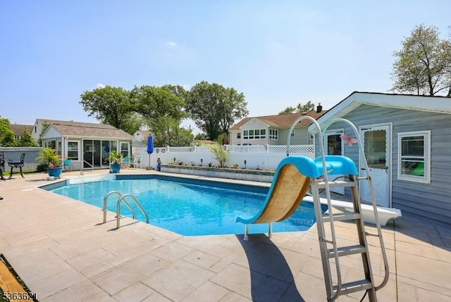 44 Shetland Dr, Clark Twp, NJ 07066 - view of pool with a water slide, a patio area, and an outbuilding
