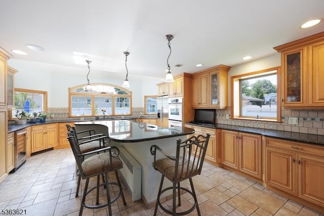 44 Shetland Dr, Clark Twp, NJ 07066 - kitchen with a breakfast bar area, decorative backsplash, beverage cooler, a kitchen island with sink, and plenty of natural light