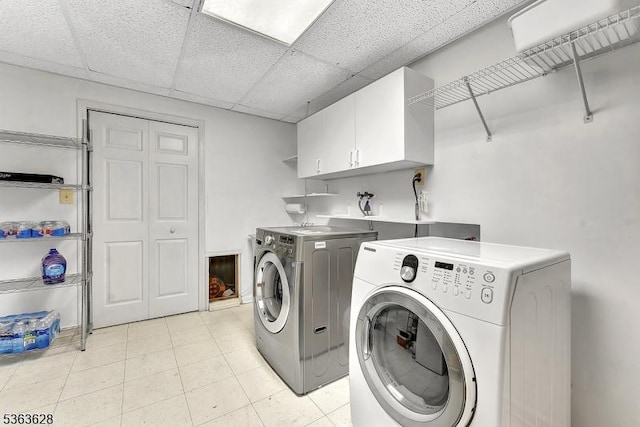22 Flemming Dr, Hillsborough Twp, NJ 08844 - laundry area featuring cabinet space, washing machine and dryer, and light tile patterned floors