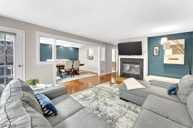 22 Flemming Dr, Hillsborough Twp, NJ 08844 - living room featuring a fireplace with flush hearth and wood finished floors
