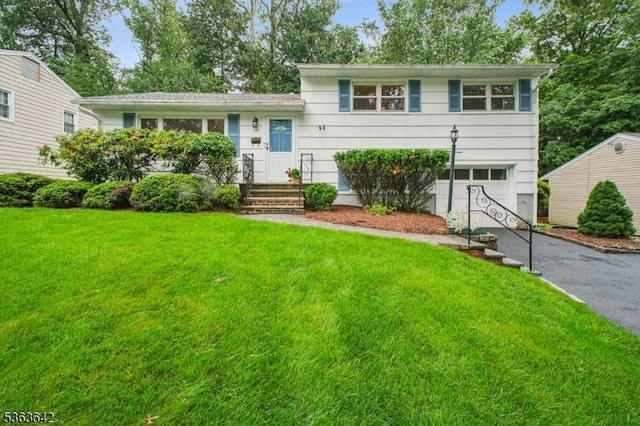 131 Harper Ter, Cedar Grove Twp, NJ 07009 - split level home featuring driveway, a garage, and a front yard