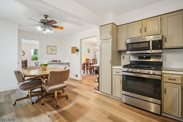 131 Harper Ter, Cedar Grove Twp, NJ 07009 - kitchen with stainless steel appliances, light countertops, light wood-style floors, and ceiling fan