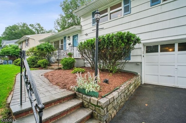 131 Harper Ter, Cedar Grove Twp, NJ 07009 - entrance to property featuring a garage and driveway