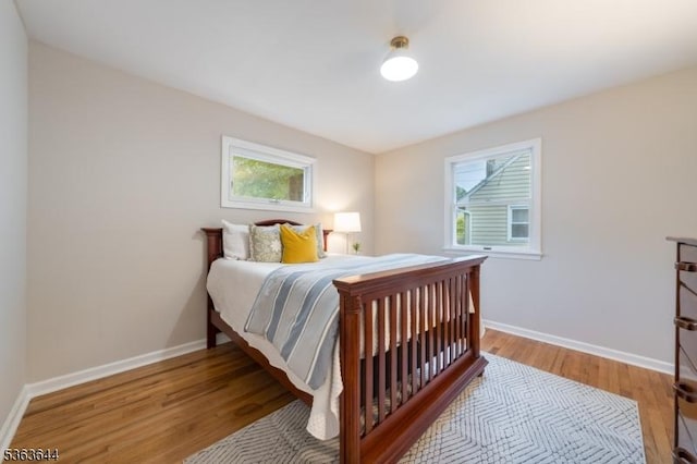 27 Brook Rd, New Providence Boro, NJ 07974 - bedroom featuring multiple windows and light wood-style floors